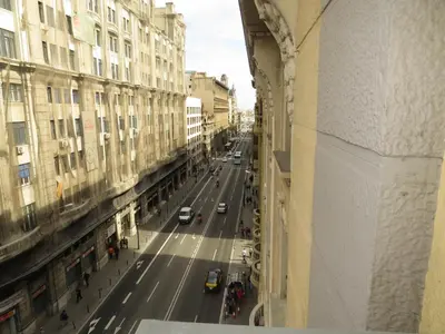 a view of a city street with cars and buildings at Pensión Casa Blanca in Barcelona