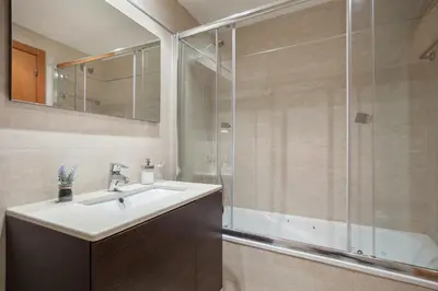 a bathroom with a sink and a shower at ApartsNouBcn Fira Barcelona in Hospitalet de Llobregat
