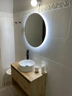 a bathroom with a sink and a mirror at Hostal El Ninot in Barcelona