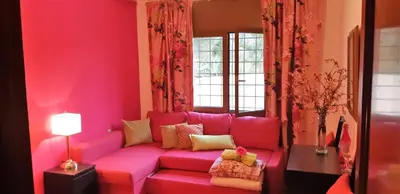 a pink living room with a pink couch at Ashram Villa Sunshine in Sitges