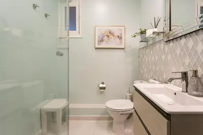 a bathroom with a toilet and a sink and a shower at Luxury & Elegant Apartment in the centre in Barcelona