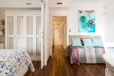 a bedroom with two beds and a bathroom at Beautiful & Luxury Apartment centrally-located in Barcelona