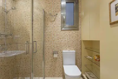 a bathroom with a toilet and a glass shower at Beautiful & Luxury Apartment centrally-located in Barcelona