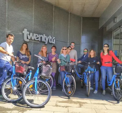 a group of people standing next to their bikes at Twentytu Hostel Barcelona in Barcelona