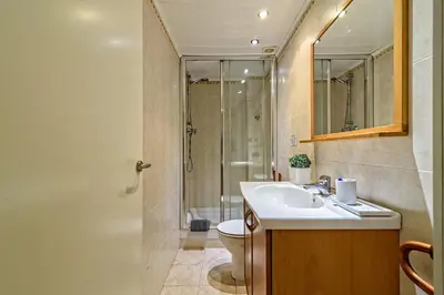 a bathroom with a toilet and a sink and a shower at Loft en Badalona Centro in Badalona