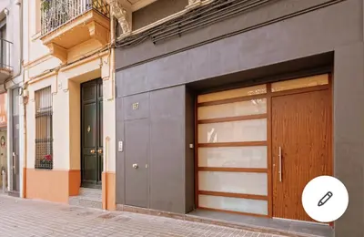 two garage doors on the side of a building at Loft en Badalona Centro in Badalona