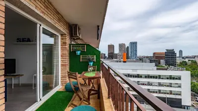 a balcony with a table and a view of the city at Bed&Bcn Glories in Barcelona