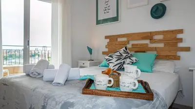 a bedroom with a bed with a tray on it at Bed&Bcn Glories in Barcelona