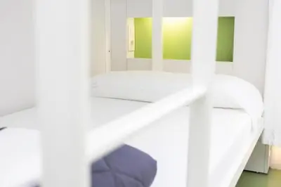 a bathroom with a white sink and a mirror at Sant Jordi Hostels Gracia in Barcelona