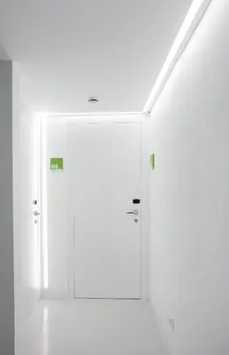 a room with white walls and a door in it at Sant Jordi Hostels Gracia in Barcelona