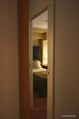 a door leading to a bedroom with a bed at Alcam Alio Cine in Barcelona