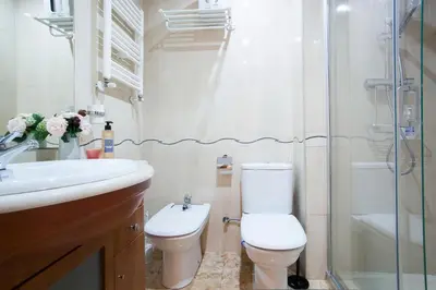 a bathroom with a toilet and a sink and a shower at Tendency Apartments Forum 2 in Barcelona