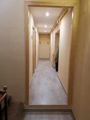 a hallway with a long hallway at Cal Duran in Esparreguera