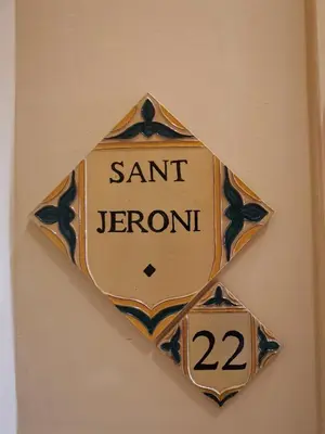 a sign on a wall with the words san jernoit at Cal Duran in Esparreguera