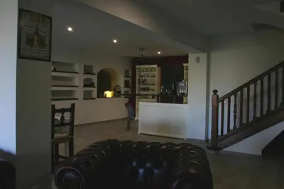 a living room with a couch and a kitchen at B&B Premium in Premia de Dalt