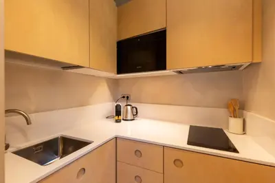 a kitchen with a sink and a microwave at Decô Apartments Barcelona-Born St. in Barcelona