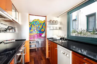 a kitchen with a sink and a stained glass window at Luxury Penthouses 2 in Barcelona