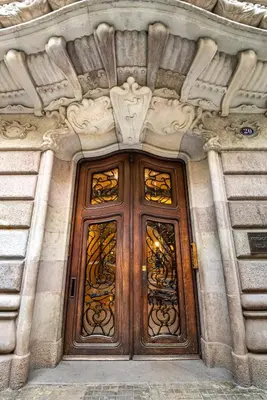 a pair of wooden doors on a building at Luxury Penthouses 2 in Barcelona
