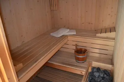 a inside of a sauna with a bucket in it at BlueLine 25km BCN-Piscina, sauna y vistas al mar in Mataró