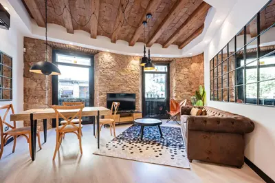 a living room with a couch and a table at Midtown Luxury Apartments by Sweett in Barcelona