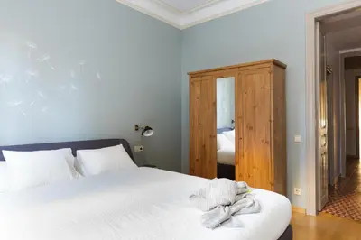 a bedroom with a bed with a towel on it at Casa Cosi - Mallorca 2 in Barcelona
