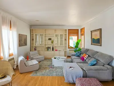 a living room with a couch and a table at Villa El Faro by Hello Homes Sitges in Vilanova i la Geltrú