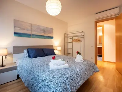 a bedroom with a bed with two pillows on it at Stay Barcelona Maragall in Barcelona