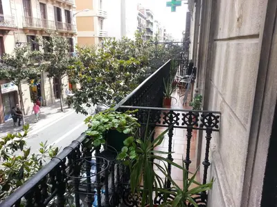 a balcony of a building with plants on it at Barcelona Housing recommend for Students in Barcelona