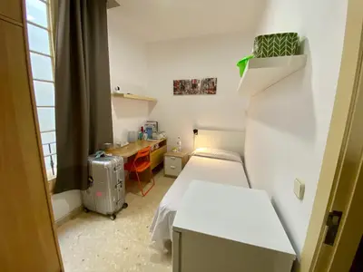 a small room with a bed and a desk at Barcelona Housing recommend for Students in Barcelona