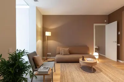 a living room with a couch and a table at DestinationBCN Universitat Apartments in Barcelona