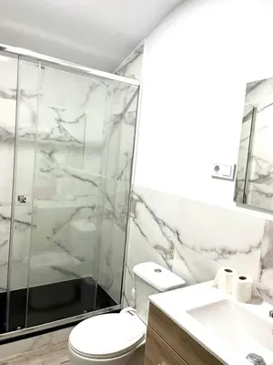 a bathroom with a shower and a toilet and a sink at Barceló Apartaments in Monistrol