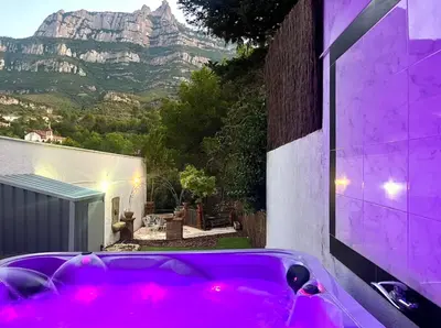 a hot pink bath tub in front of a house at Barceló Apartaments in Monistrol