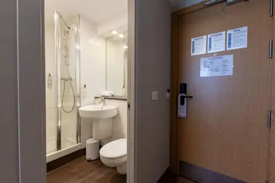 a bathroom with a toilet and a shower and a sink at Travelodge Barcelona Poblenou in Barcelona