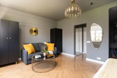 a living room with a couch and a table at TSA Gran Via in Barcelona