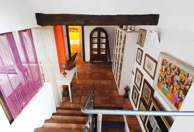 a view of a staircase with paintings on the wall at Entre Olivos: Very Charming Villa 18 SLEEPERS in Sant Pere de Ribes