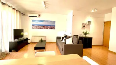 a view of a city skyline with buildings at Sagrada Familia Attic - Terrace Bcn Views in Barcelona