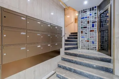 a walk in closet with a staircase and lockers at Sweett - Comte Urgell in Barcelona