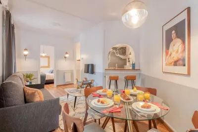 a living room with a table with food on it at Sweett - Comte Urgell in Barcelona