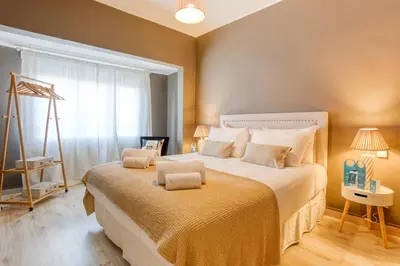 a bedroom with a large bed with two pillows on it at Sweett - The Roca House in Barcelona