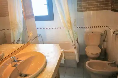 a bathroom with a sink and a toilet and a tub at Comfortable house near Esparreguera with city view in Esparreguera