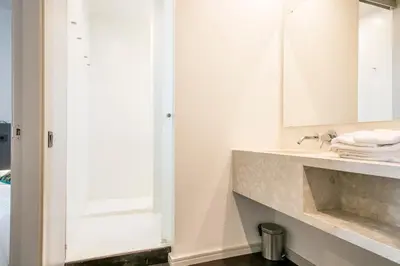 a bathroom with a sink and a mirror at My Address in Plaza Real in Barcelona