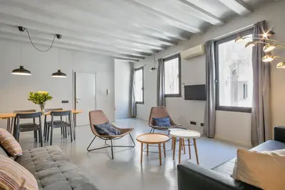 a living room with a couch and chairs and a table at My Address in Plaza Real in Barcelona