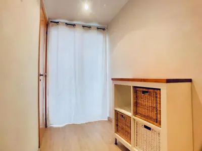 a room with a window with a curtain and a shelf at Bed&BCN Gracia II in Barcelona