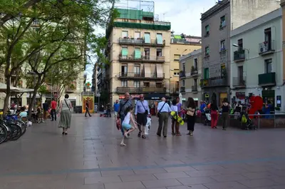 a group of people walking down a city street at Bed&BCN Gracia II in Barcelona