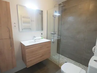 a bathroom with a sink and a shower at Balcony View Apartment by Hello Homes Sitges in Sitges