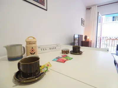 two cups on a kitchen counter with a tea hits sign at Balcony View Apartment by Hello Homes Sitges in Sitges