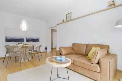 a living room with a couch and a table at Sweett - Monumental in Barcelona