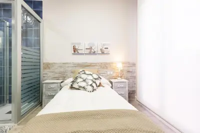 a bedroom with a bed and two night stands at Urban Sabadell in Sabadell