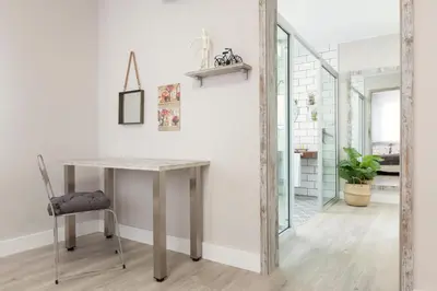 a table and a chair in a room at Urban Sabadell in Sabadell
