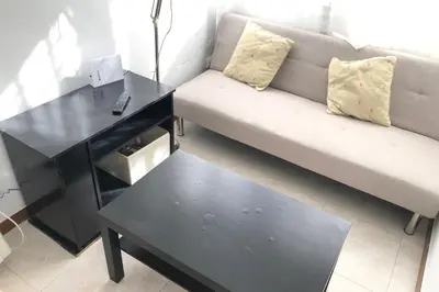 a living room with a couch and a coffee table at New! Apartment for 3 people near Fira Gran Via in Hospitalet de Llobregat